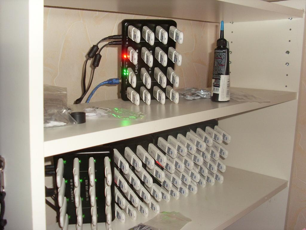 Large array of multiple Huawei USB GSM modems connected via USB hubs for high-volume calling